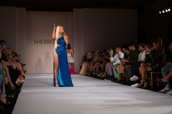 Loren Gray performing on the runway for the finale of the Sherri Hill Spring 2022 show